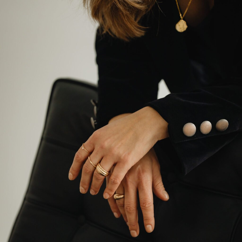 kaboompics jewelry photo shoot woman wearing gold rings and necklace 29228