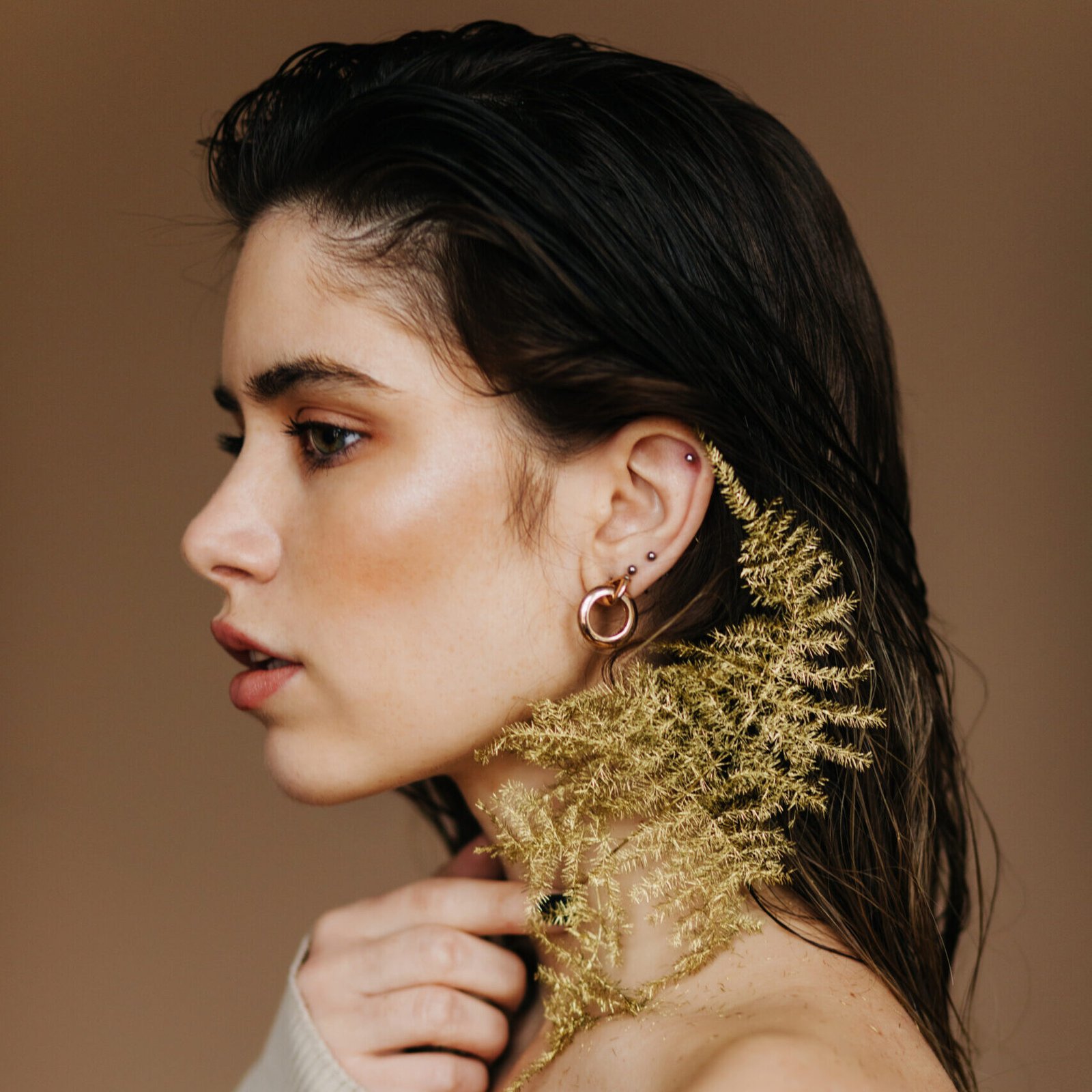 indoor portrait of lovable brunette woman with plant. lovely you