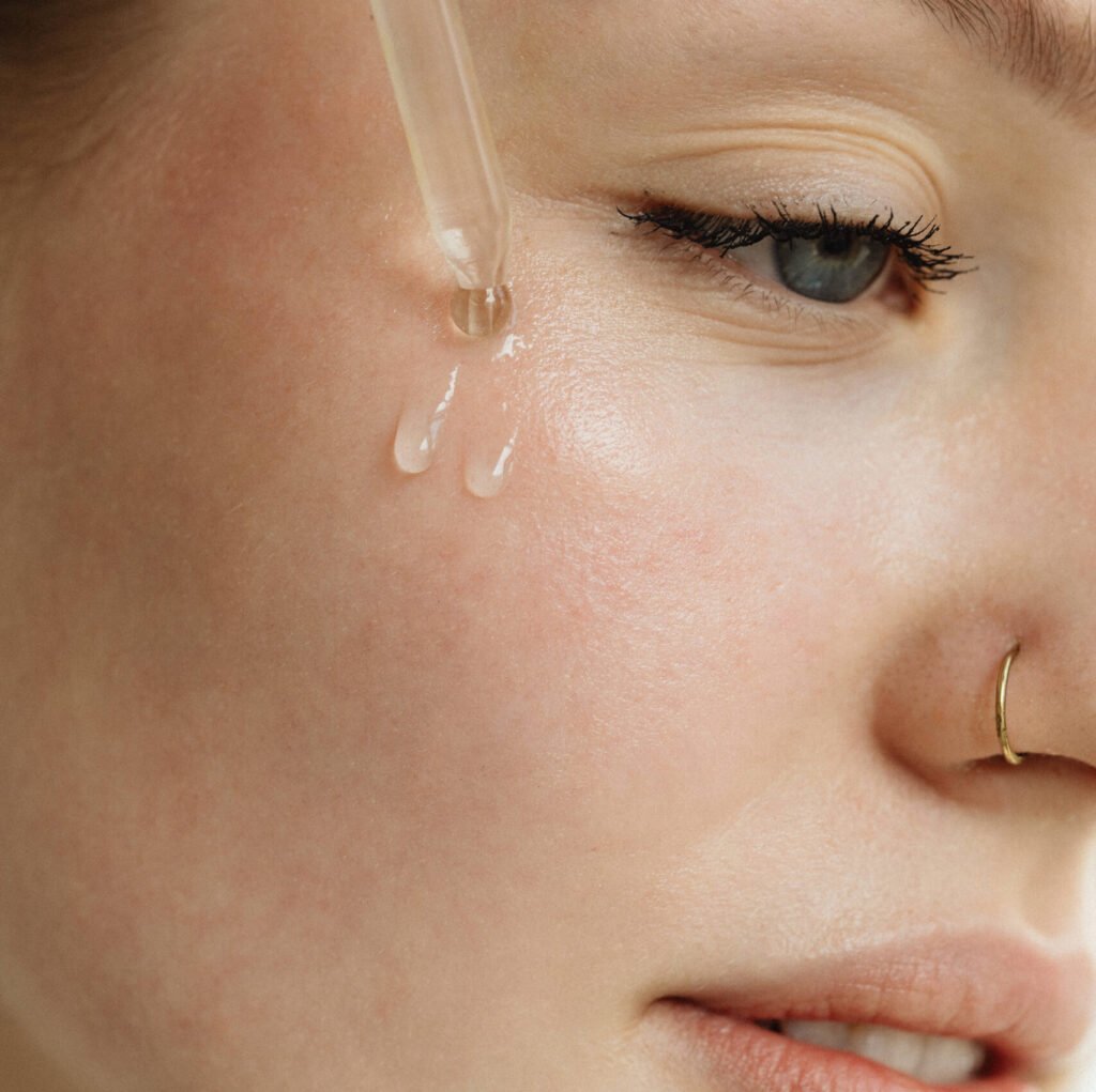 kaboompics applying facial serum for enhanced skin care 32027