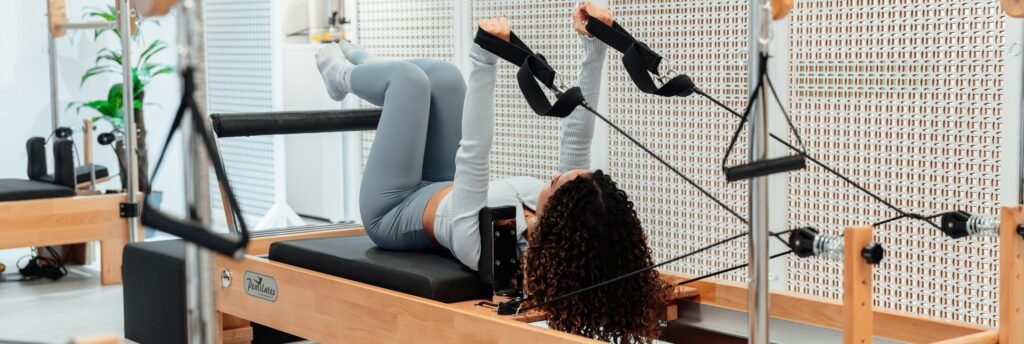 Home reformer Pilates setup in a minimal studio space