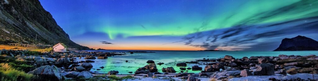 Northern Lights over snowy Scandinavian landscape