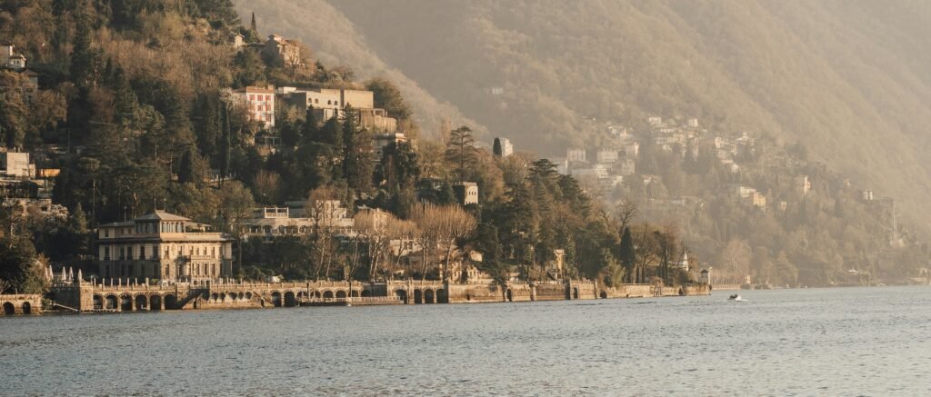 Lake Como in winter with misty mountains and quiet waterfront
